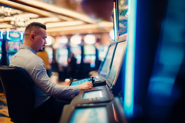 A young woman relaxing with her phone while dynamic casino elements float around her, illustrating the smooth mobile experience offered by the ZS999 app.