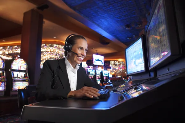 A cheerful woman in traditional clothing using her smartphone during a festive moment, showing how easily the ZS999 app fits into everyday life.