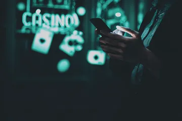 A close-up shot of golden coins falling around a spinning roulette wheel, representing immersive casino action at ZS999.
